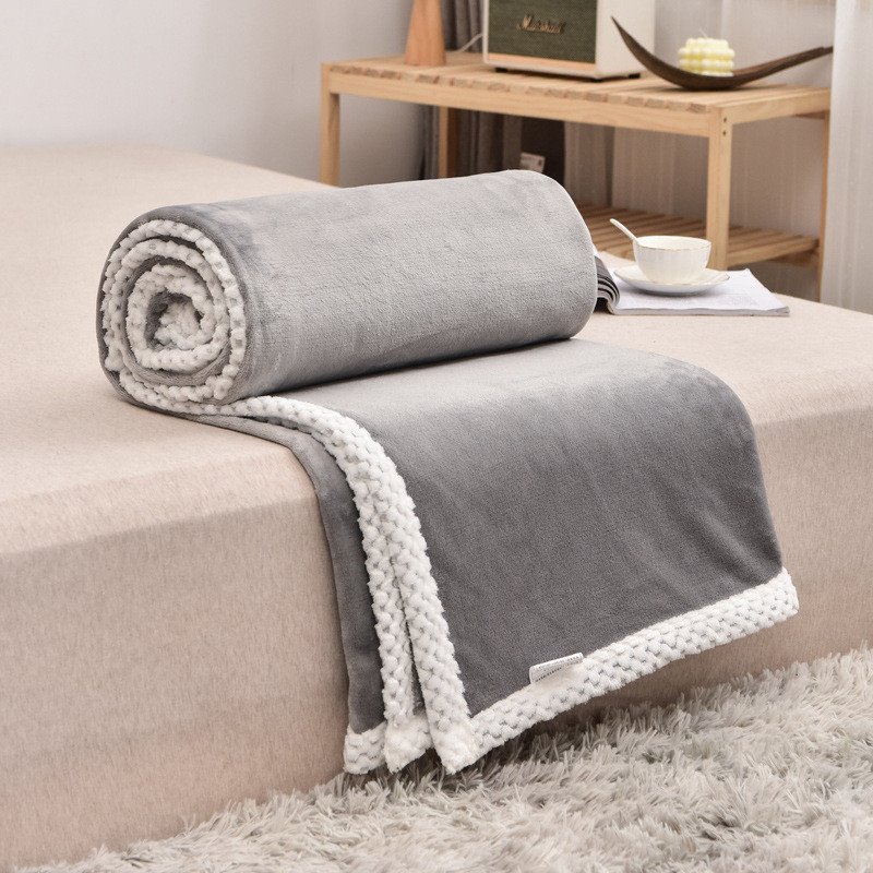 Korallenfarbene Strickdecke